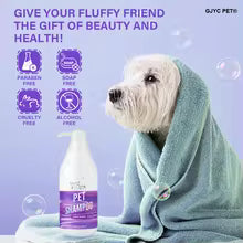 A small white dog wrapped in a teal towel sits beside a pet shampoo bottle on a light purple background with promotional text and icons.